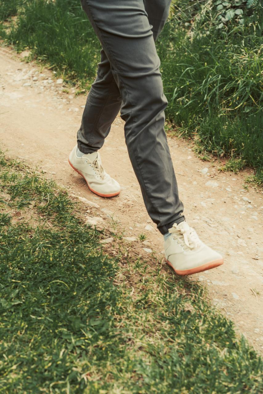 feet walking along a green lane path